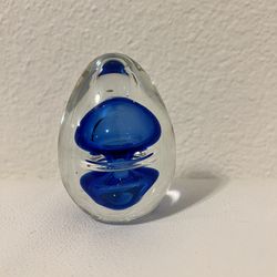 vintage art glass paperweight in the shape of an egg, clear blue bubbles, ocean