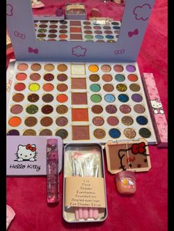Hello kitty gift set perfume, blush eye shadow pallet lotion.