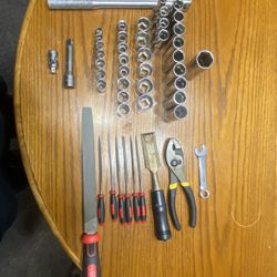 unboxed tools wrenches with sockets,metal files,chisle.pliers