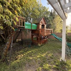 Wooden Backyard Playset with Slide and Swings – Sturdy but Needs Refinishing