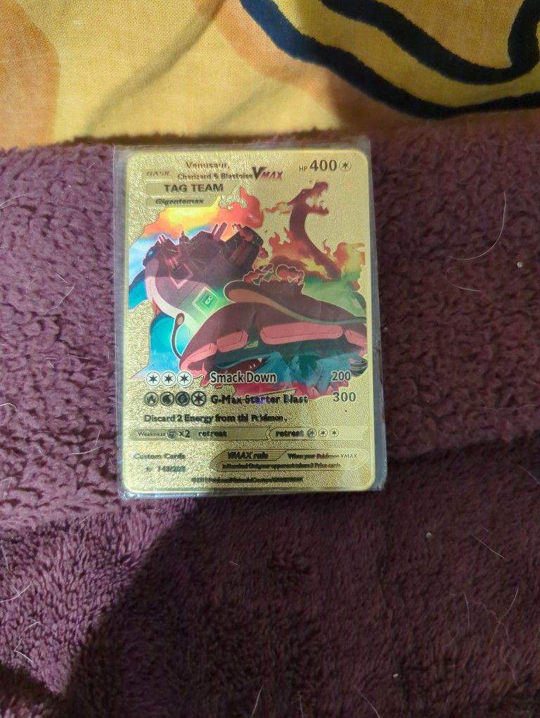 Gold metal Venusaur, charizard, and blastoise tag team pokemon card