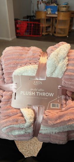 Pink and white Ulta throw blanket