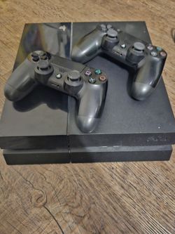 Sony PlayStation 4 Console with Two Controllers