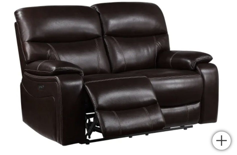Leather power reclining loveseat with power headrest. Comes with a fabric cover