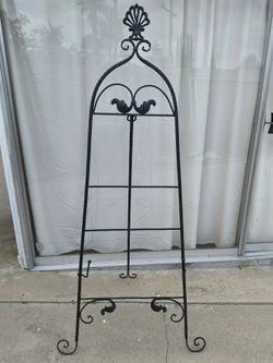 A heavy duty never used black metal 62" high easel