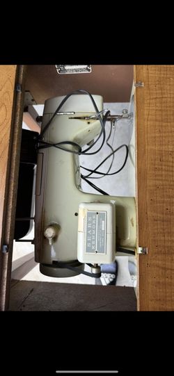 Sewing Machine In Cabinet