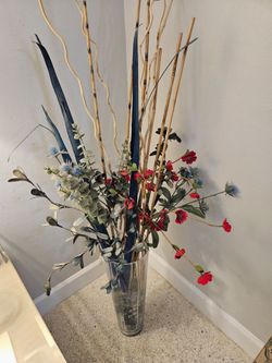 Silk flower arrangement with vase and glass pebbles