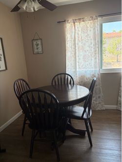 Round dining table with four chairs