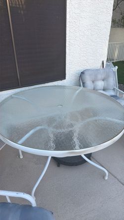 Outside glass table with 4 chairs