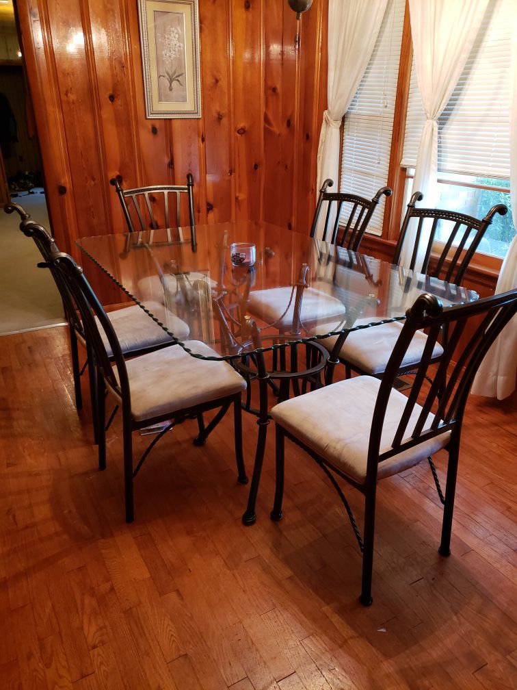 Glass top table with 6 chairs.