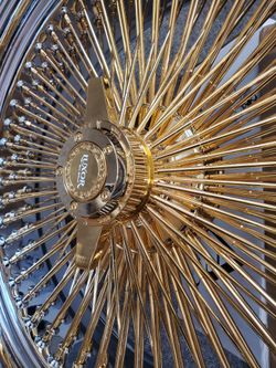 4 22INCH GOLD WIRE WHEELS WITH CHROME LIP AND GOLD KNOCK OFF CENTER CAPS WITH ALL HARDWARE $3300