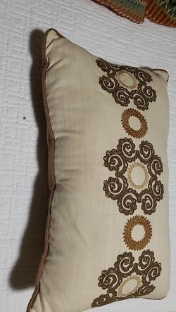 Throw pillow lumbar neutral colors.