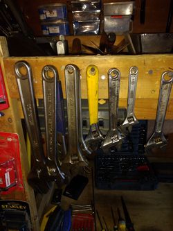 Adjustable crescent wrenches