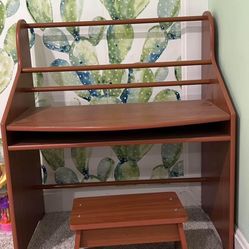 Child’s brown desk and chair 