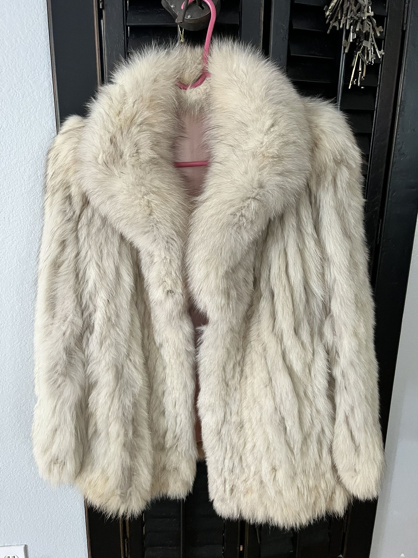 This is a Saga Fox fur coat with a pink satin lining.