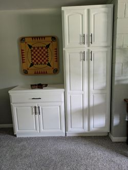 2 Cabinets Excellent Condition.  Tall one 200, small 100.  Can Be Sold Individually.