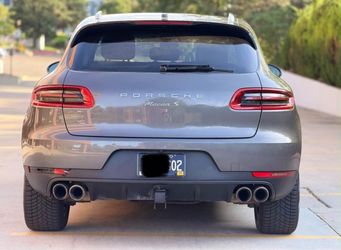Porsche macan S outside is grey with a black interior