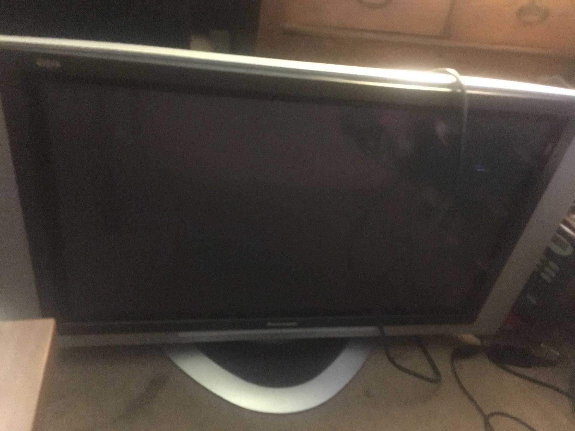 Panasonic 48” Tv with its remote control