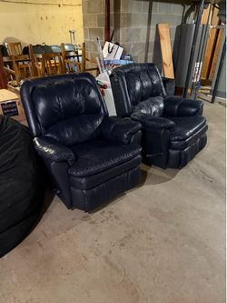Two Blue Lazy Boy recliners.
