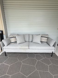 Gray Sofa w/ decor pillows - model home furniture