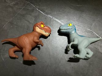 T-Rex and blue velociraptor goo jit zu 2 pack