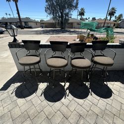 4 swiveling barstool chairs
