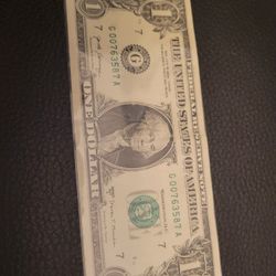 Dollar bill with low serial number