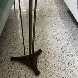 Sofa and a brass floor lamp and a brass and glass table