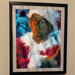I have a custom art piece of the grinch played by Jim Carrey on a 12x10 black picture frame that would look good in any home or office wall it and it 