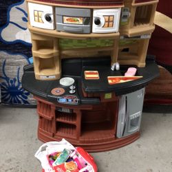 Toy kitchen set with old accessory