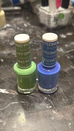 DND nail polishes - pistachio green & linen blue