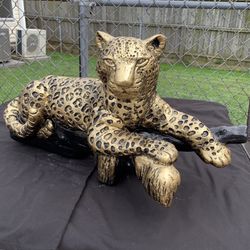 Golden Leopard On The Log Statue