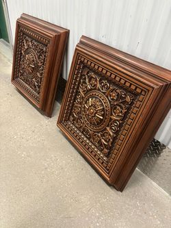 Two wood framed molded acrylic designs… rust metallic color…28” x 29”  $60 for both.