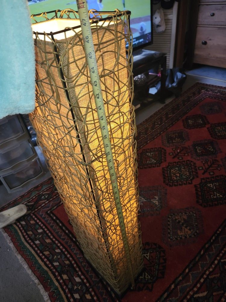 Modern/ contemporary tall floor lamp with wicker or rattan material