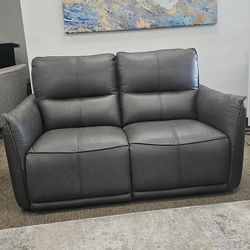 Leather Loveseat With 2 Power Recliners. 
