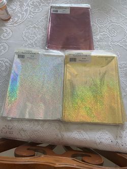 HOLOGRAPHIC SPARKLE GLITTER SHEETS . 2 SHEETS  20”. X  30”  10 RED , 12 SILVER 21 GOLD AT  $1.00. FOR SALE IN MÍA BEACH, FLA