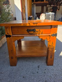 Solid wood side table.