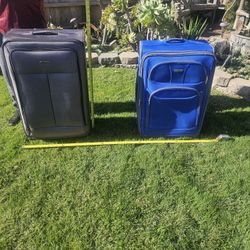 2 Expandable Rolling Suitcases - $20