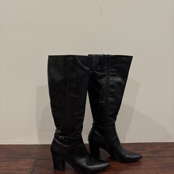 Leather knee high heeled boots