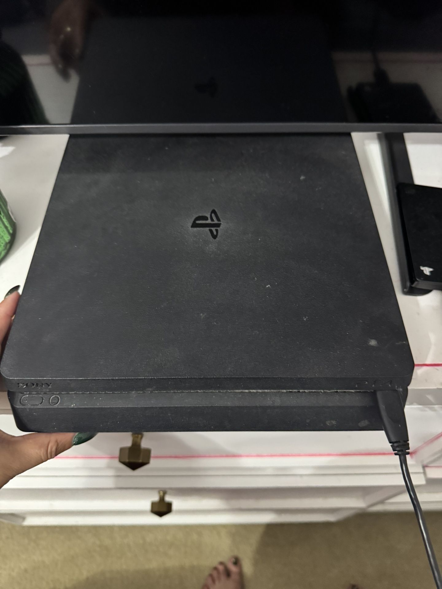 ps4 with lots of games headset charging set and controllers