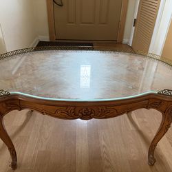Vintage French Rococo style carved wood and glass top coffee table.