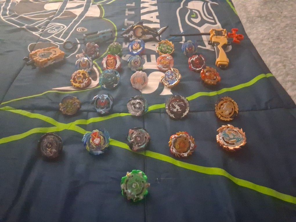 26 Beyblades And 4 Lanchers!