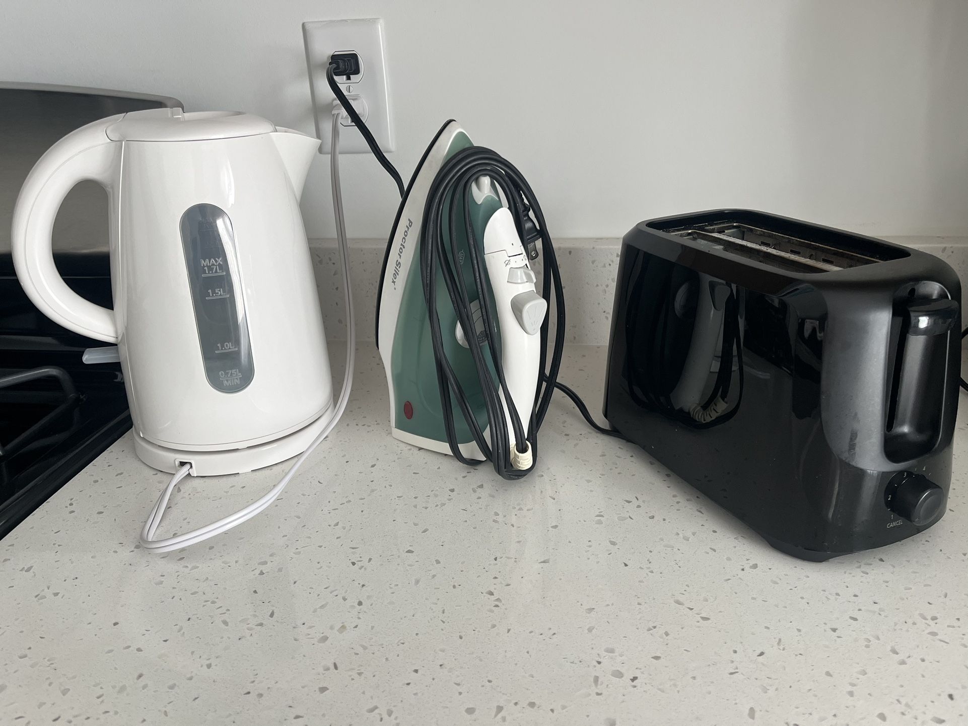 Electric Tea Kettle, Iron, And A Toaster