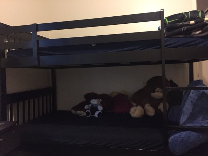 Black bunk beds with mattresses from Sam levitz