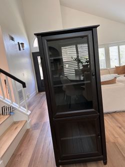 Storage cabinet with glass