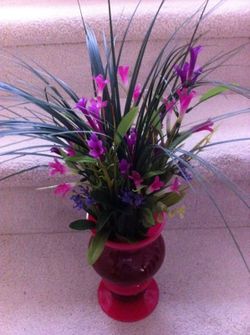 Unique tri colored vase filled with flowers