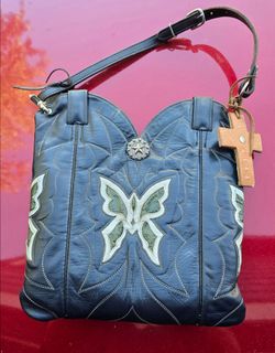 custom, upcycled cowboy boot purse handcrafted from the shafts of vintage leather cowboy boots.