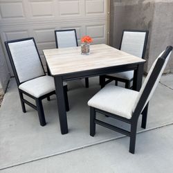 Table With 4 Chairs and  2 extending leaves Available 