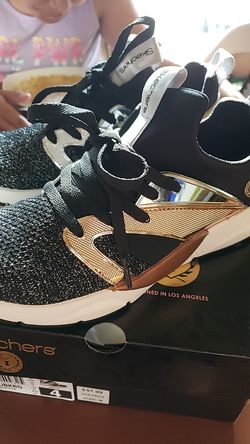 Beautiful girl gold and black sketchers size 4