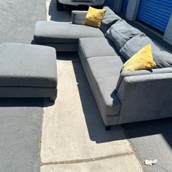 Gray Sectional Couch And Ottoman Seat,